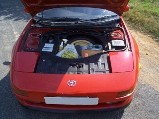 Under the bonnet - where I store all my car related junk ..